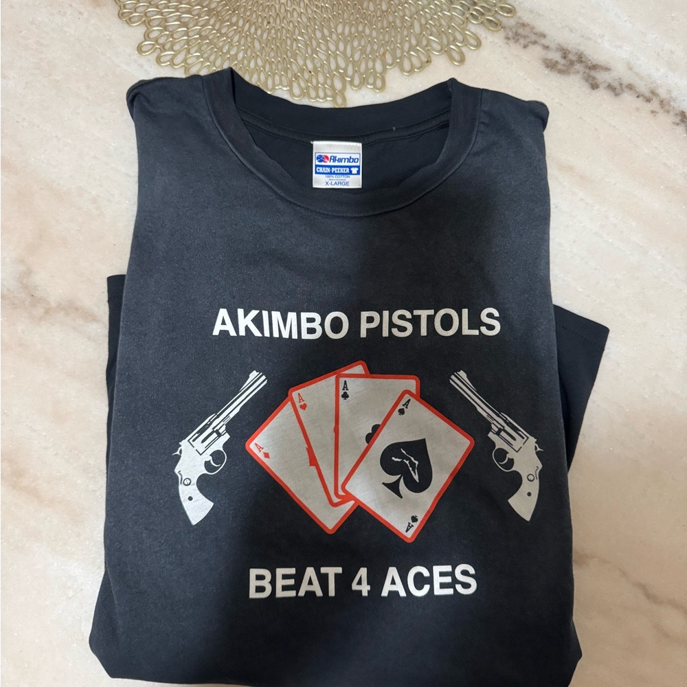CHAIN-PEEKER” AKIMBO PISTOLS TEE - FADED BLACK  AKIMBO CLUB